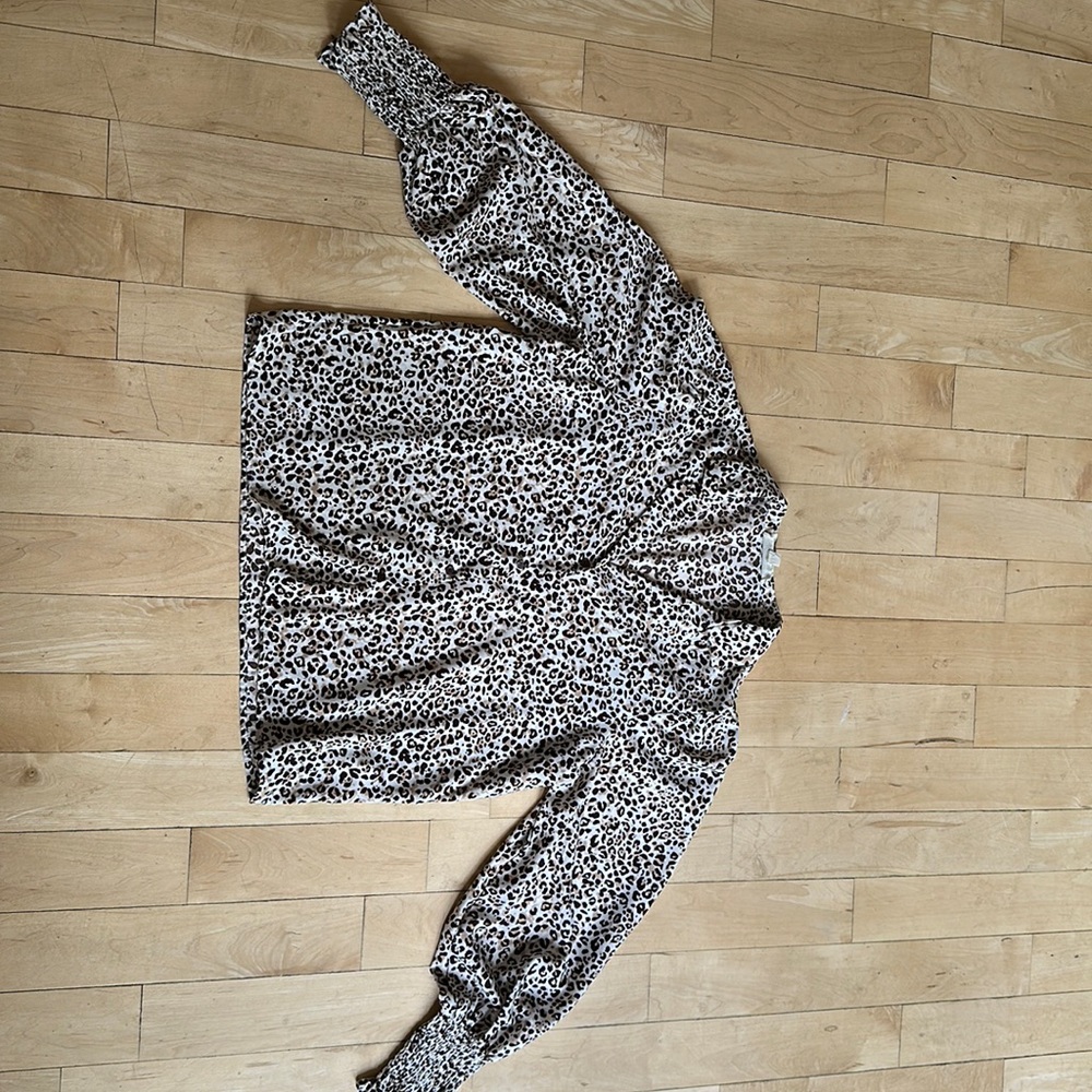 Worn once, leopard print blouse with fun, gathered cuffs.